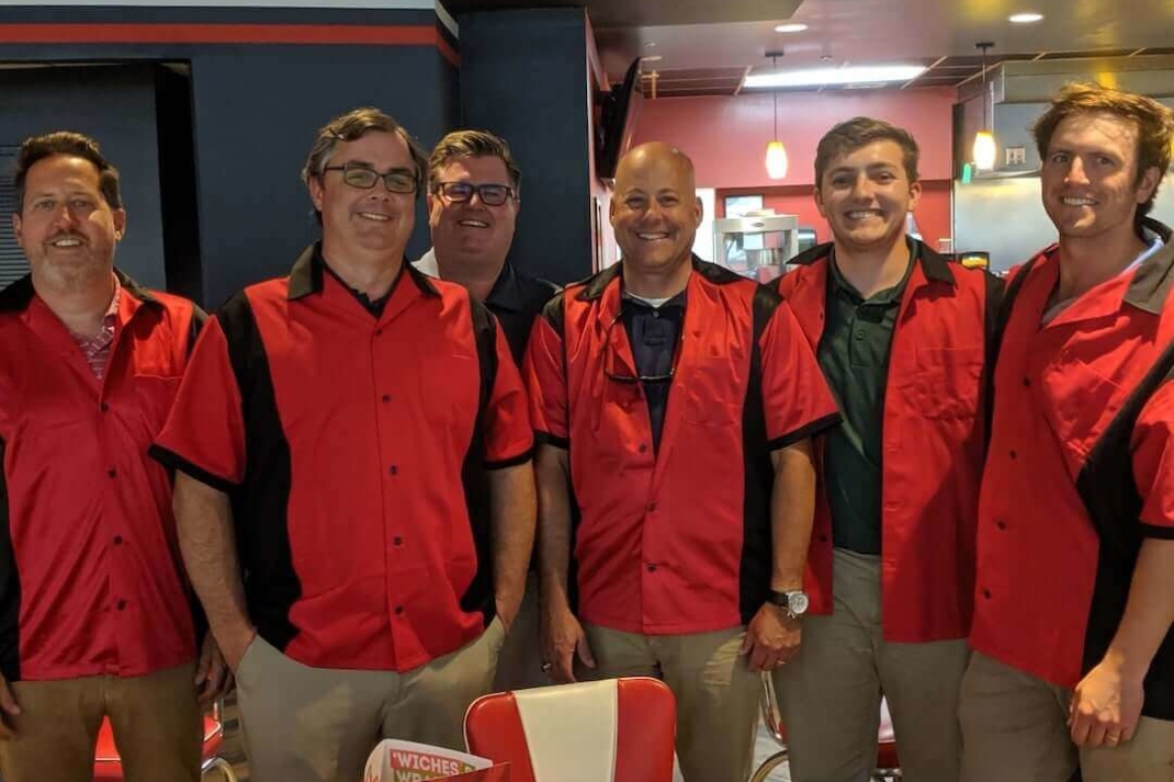 Six men wearing bowling shirts at the KBS Annual Staff Bowling Tournament